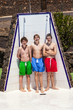 © travelview - boys have fun unter the pool shower