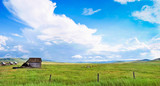Fototapeta  - Beautiful prairie landscape with old barn in Alberta, Canada.