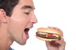 © auremar - man eating hamburger
