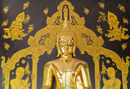 Fototapeta na wymiar gold buddha on black wall