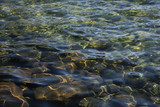 Fototapeta Morze - Mountain lake clear water on rocks