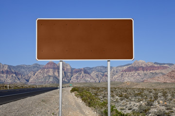 Wall Mural - Blank Brown Highway Sign in the Mojave Desert