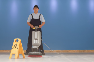 Wall Mural - cleaning floor with machine