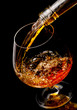 The glass with splashes cognac