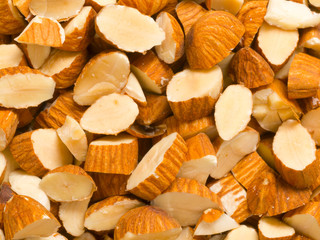 Poster - close up of chopped almonds food background