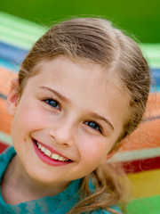 Wall Mural - Lovely girl in colorful hammock