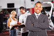 © michaeljung - happy smiling male gym manager portrait