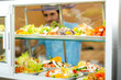© CandyBox Images - Cafeteria food display young man choose salad
