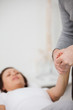 © WavebreakmediaMicro - Physiotherapist holding a painful hand