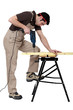 © auremar - Carpenter drill through plank of wood