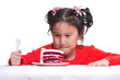 Little girl with cake in studio