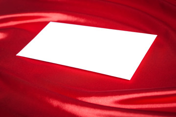 Wall Mural - Envelope over red silk background
