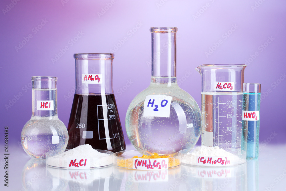 Test-tubes with various acids and chemicals on violet background