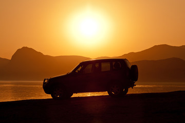 car on sunset background