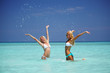 © yellowj - Two girls playing in water