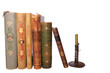 stack antique books and candlestick