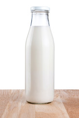 Wall Mural - Bottle of fresh milk is wooden table Isolated on white backgroun