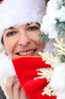 © auremar - Woman getting in to the Christmas spirit