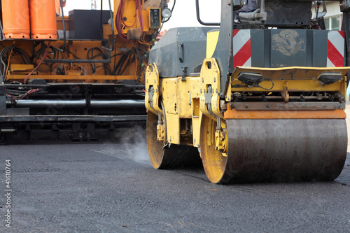 Fotografie, Obraz Roadwork road roller and paving machine at asphalt