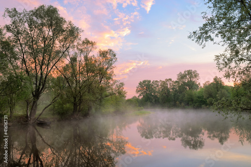 Obraz w ramie Fog and warm sky over the Narew river, Poland.