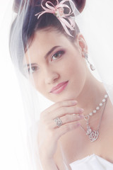 beauty young bride with beautiful makeup na hairdress in veil