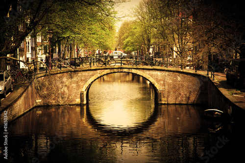 Obraz w ramie Amsterdam. Romantic bridge over canal.