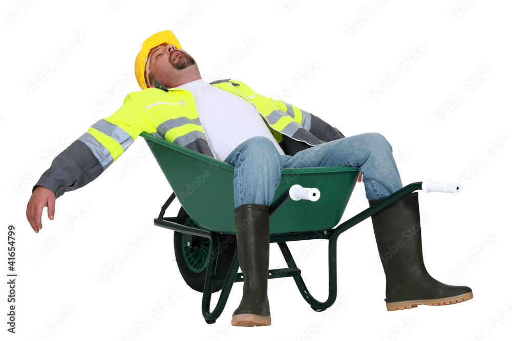 Tradesman asleep in a wheelbarrow - obrazy, fototapety, plakaty 