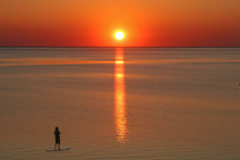Paddle Boarder At Sunset