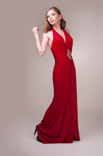 Beautiful Young Woman Wearing A Sexy Red Evening Dress