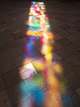 Reflection Of Stained Glass On The Stone Floor In Church