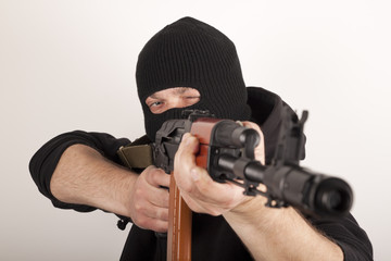 Man in mask with gun