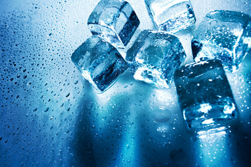 Ice cubes over wet backgrounds with back light