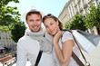 © goodluz - Smiling couple doing shopping in Bordeaux