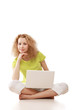 © shefkate - A young girl sitting on the floor with a laptop
