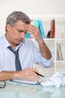 © auremar - Businessman struggling at his desk
