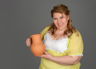 Wall Mural - cute fat woman with a pitcher of milk