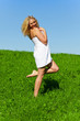 © nakedking - Woman with towel on meadow