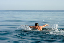 Man Swims In The Sea