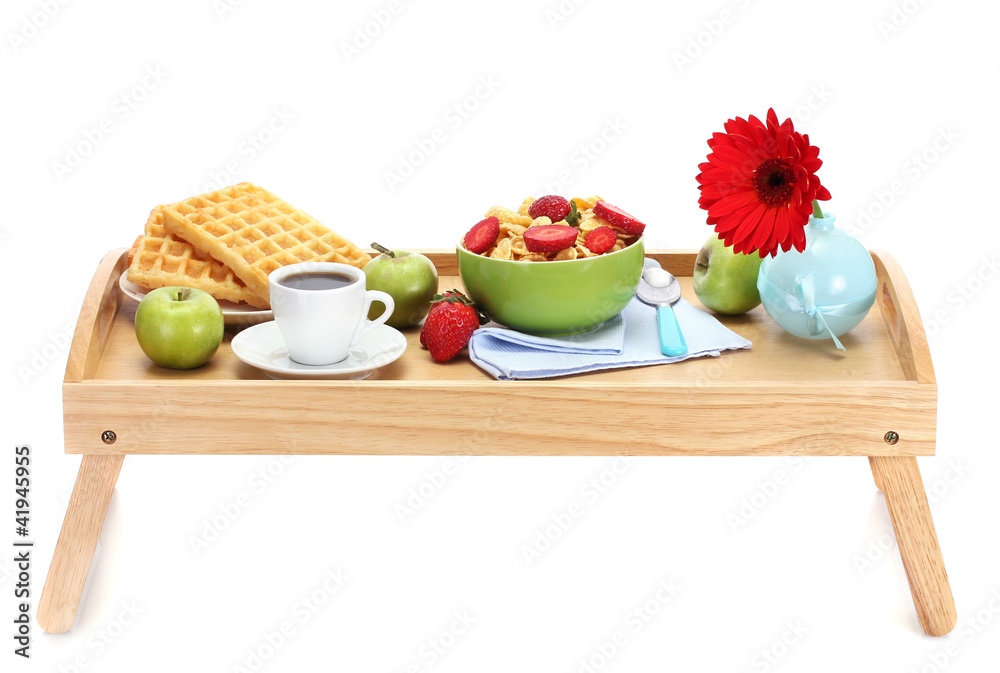 light breakfast on wooden tray isolated on white