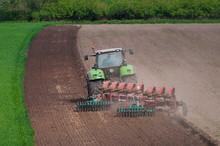 Farmer Ploughing Field