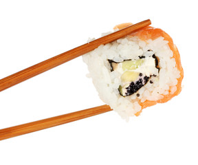 Holding roll with chopsticks isolated on white