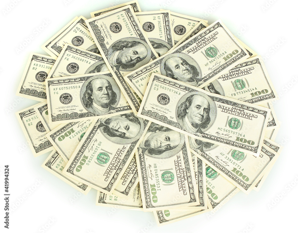 A lot of one hundred dollar bills isolated on white