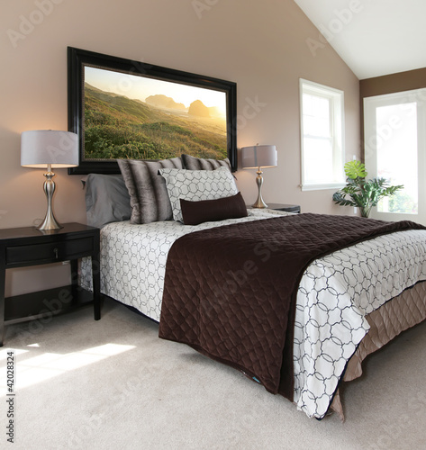 Fotografie, Tablou Modern brown and white bed with nightstands.