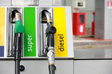 Fototapeta Przestrzenne - gasoline pump nozzles at petrol station