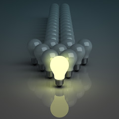 Fototapete - Leadership concept, One glowing light bulb in front of dim bulbs