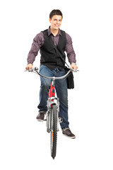 Canvas Print - A studio shot of a man riding a bike