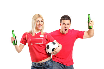 Wall Mural - Male and female euphoric fans holding beer bottles and football