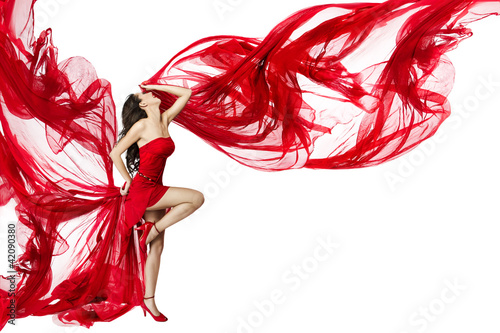 Fototapeta na wymiar Beautiful woman dancing in red dress flying on a wind flow over