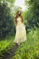 Wall Mural - Photo of romantic woman in fairy forest