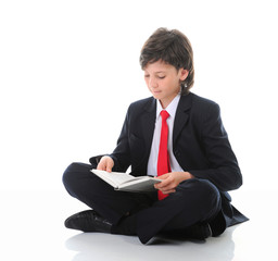 Wall Mural - little boy reading a book